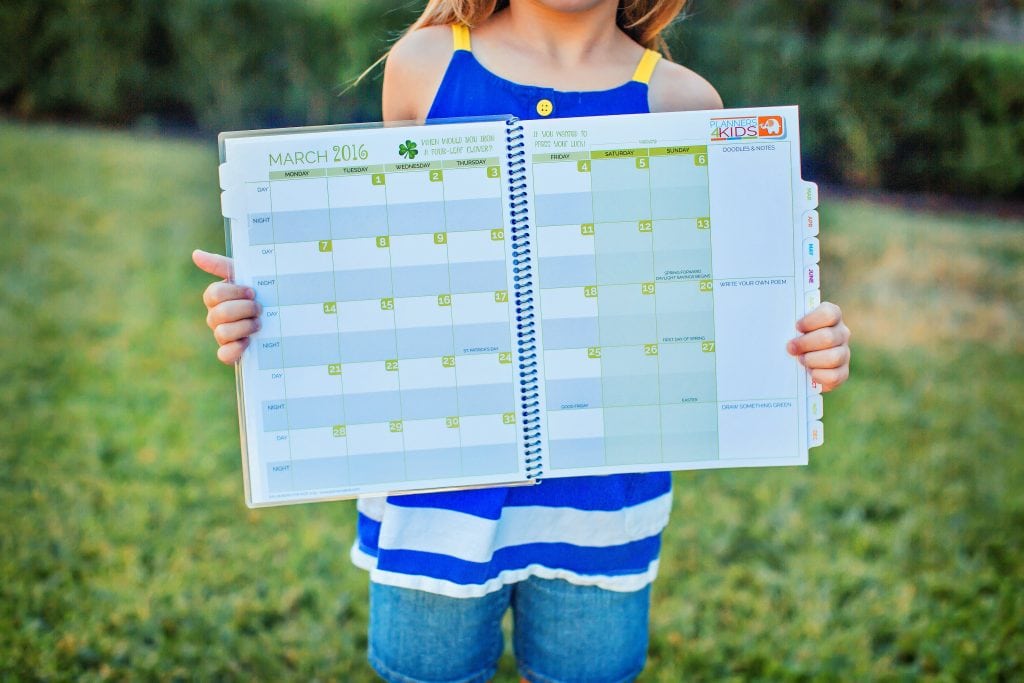 Planners4Kids girl holding a planner