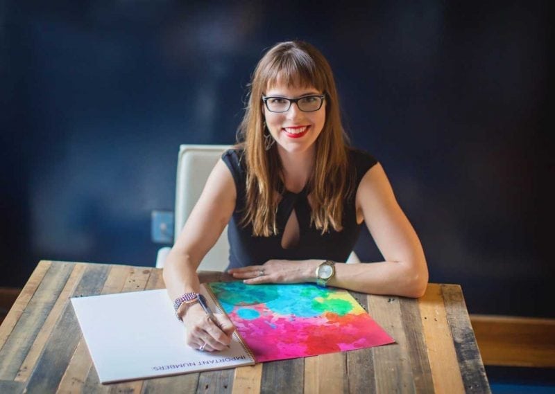 Tiffany Marascio of Planners4Kids sitting at a table smiling