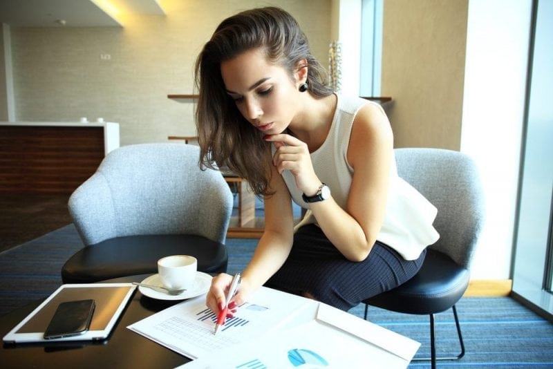 Woman looking at business papers