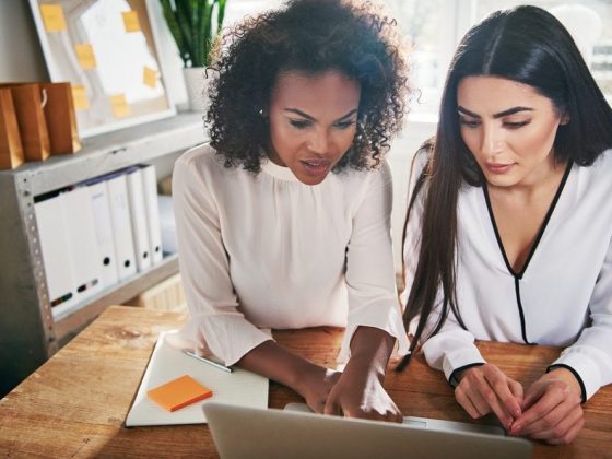 Two women working together